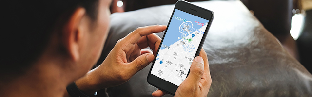 Midsection of man using mobile phone at home