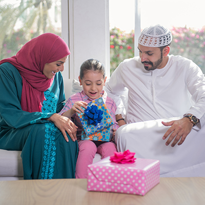 Parents sitting with daughter