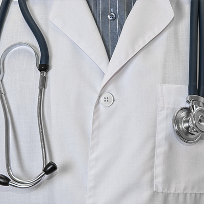 doctor with white coat and stethoscope depicting insurance