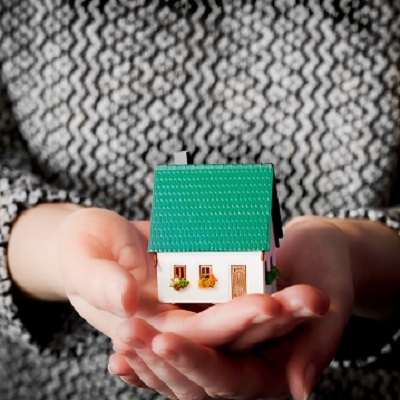 Px photo id woman holding a small new house in her hands real estate mortgage housing concepts etc