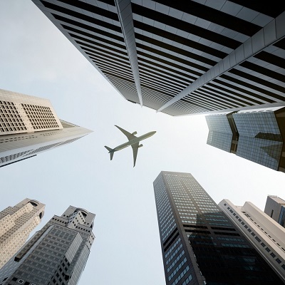 Px photo id tall city buildings and a plane flying overhead