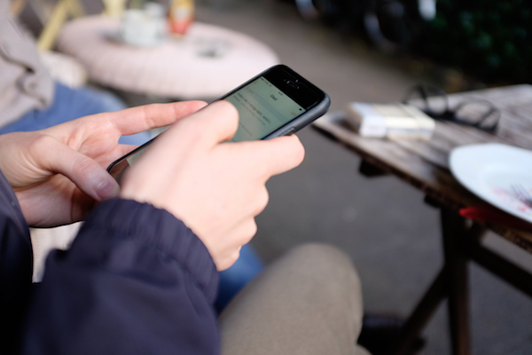 Using mobile phone in a cafe httpbarnimagescom
