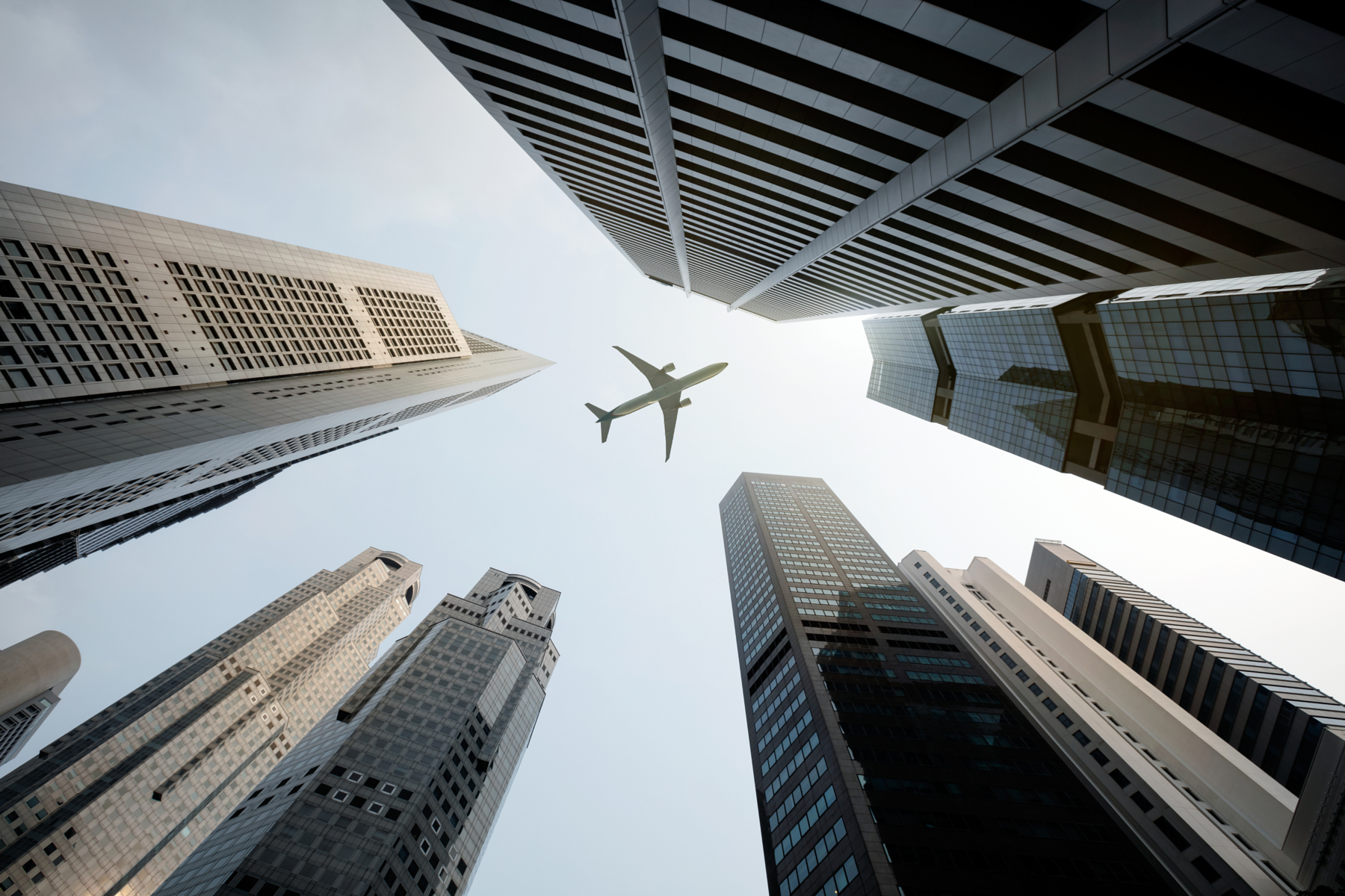 Px photo id tall city buildings and a plane flying overhead