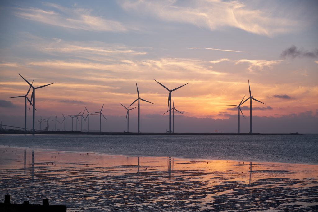 Sunsetting behind wind turbines