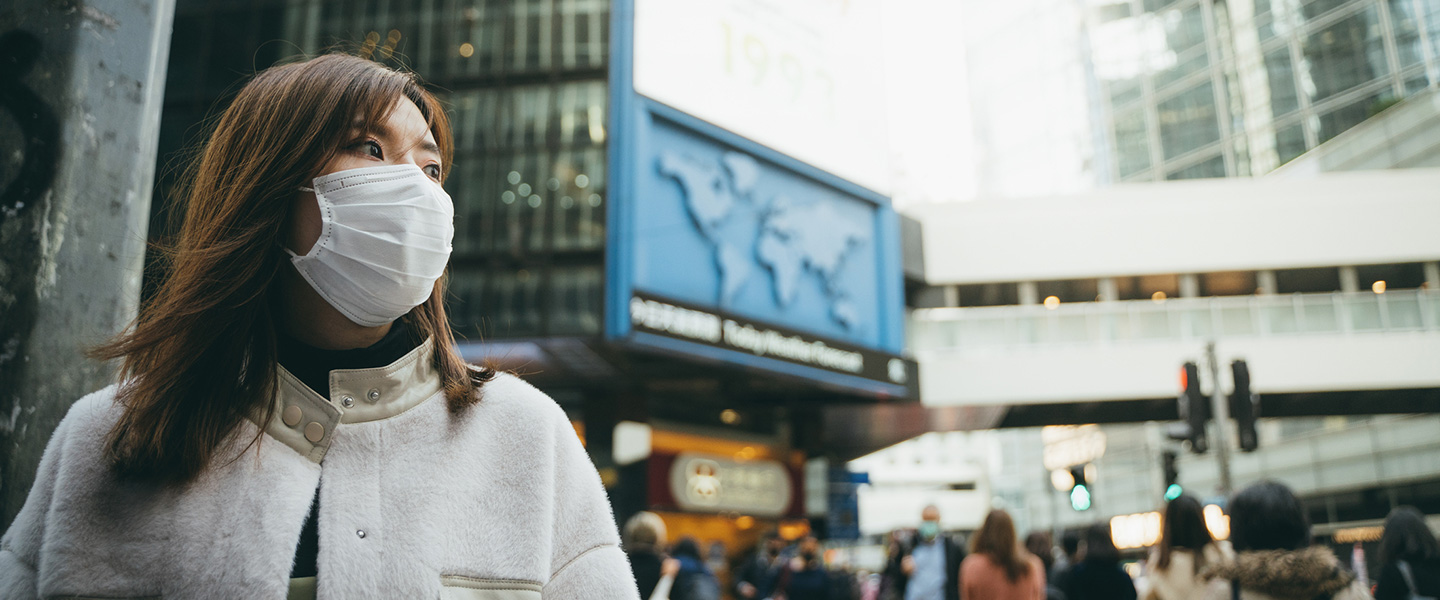 woman in city wearing face mask