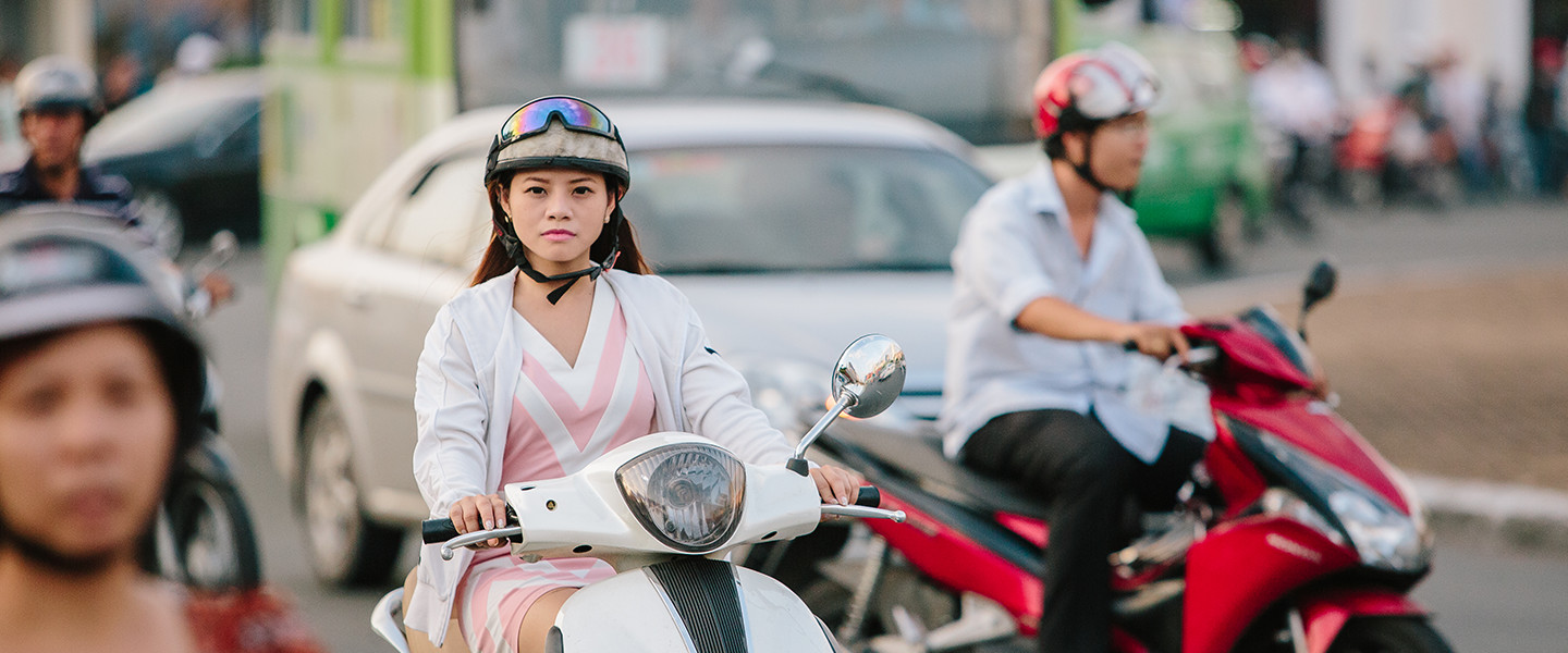 woman riding moped