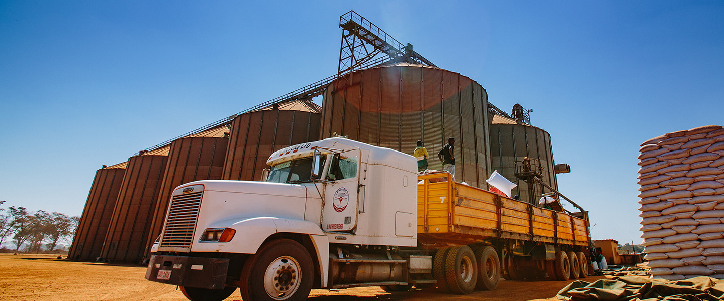 truck in front of storage silos