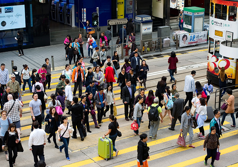 crowd using zebra crossing