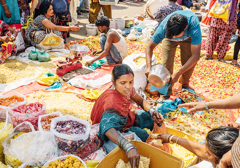 woman sat on floor surrounded by food