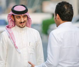 Two men discussing cross border financing