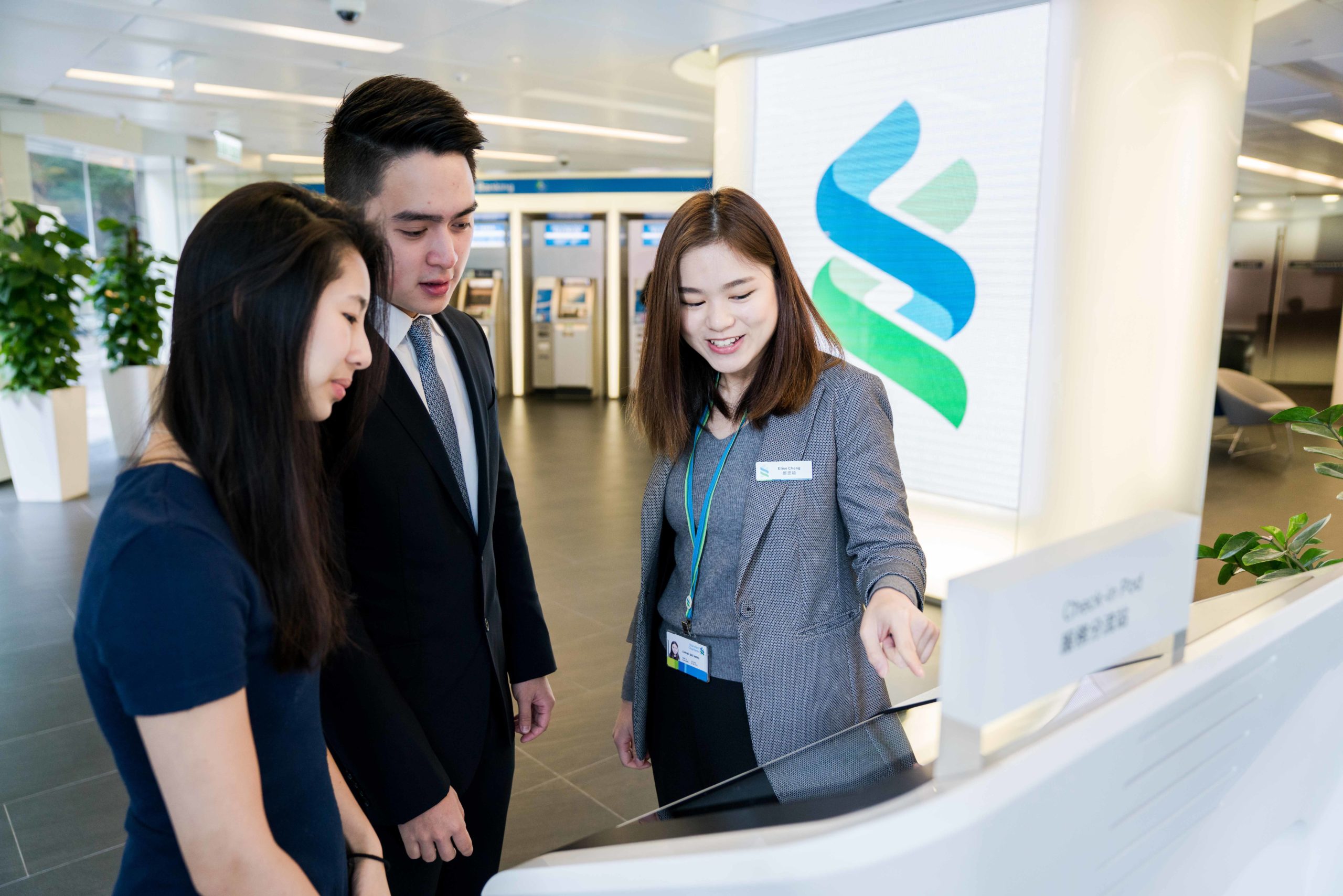 Standard Chartered colleague talking to clients