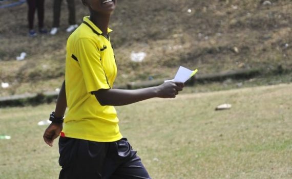 Referee in yellow polo shirt