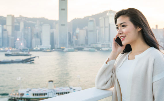 woman talking on phone outside