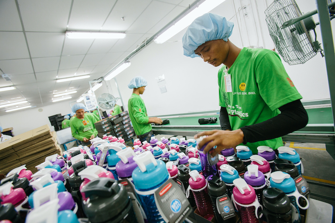 Supply workers sorting water bottles