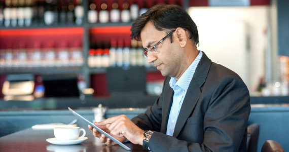 Man checking shareholdings on iPad