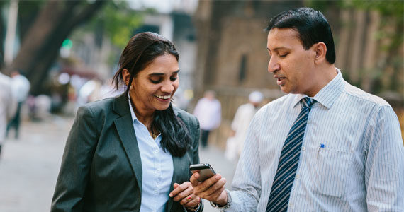 Couple using Straight2Bank wallet