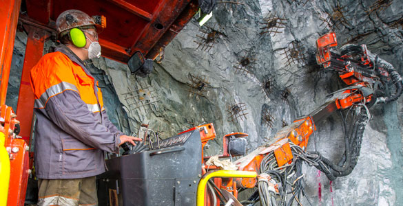 Man operating mining machine