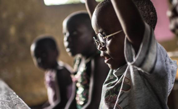 Boys in school, showing how Seeing is Believing is changing lives
