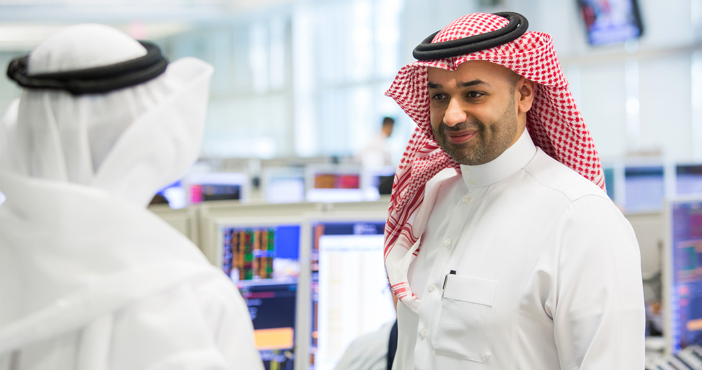 Two men talking about financial market services