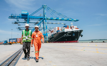 Supporting sustainable economic growth men in port