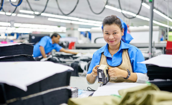 Woman smiling working in factory