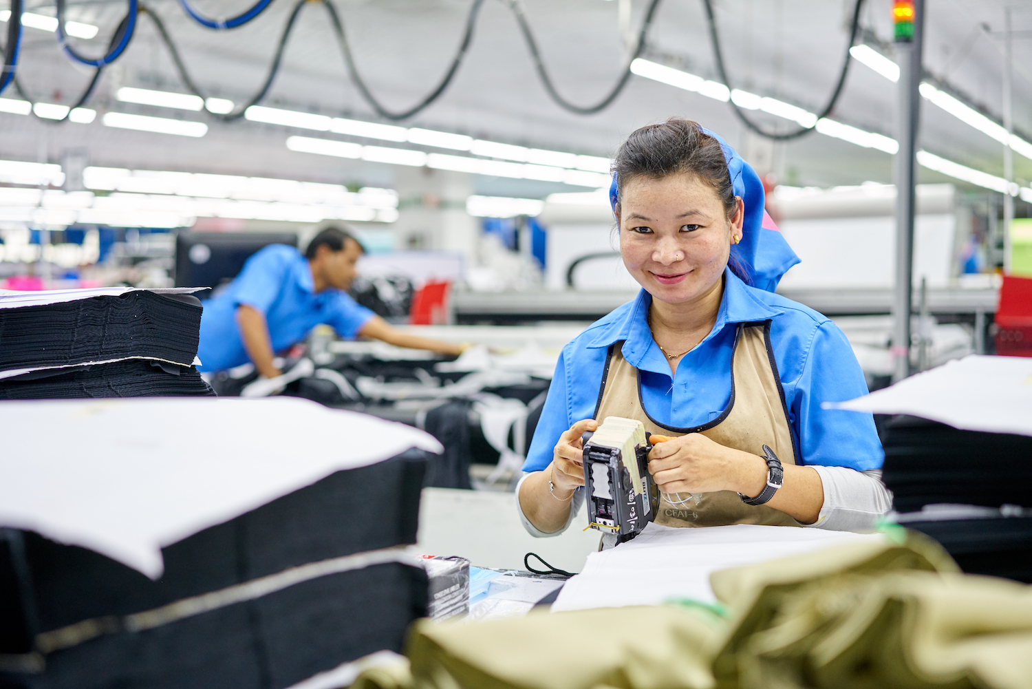 Woman smiling working in factory