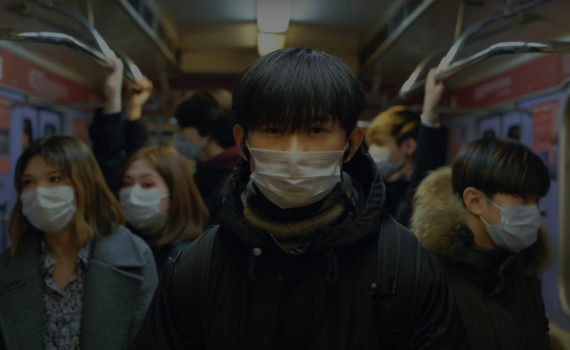 People on train wearing facemasks