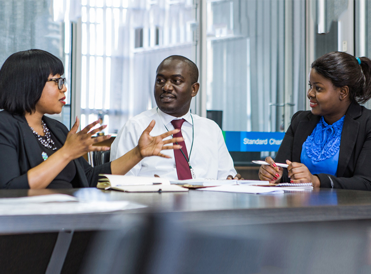 Colleagues discussing financial regulations