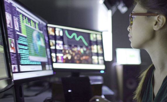 Man looking at computer monitoring for cyber security threats