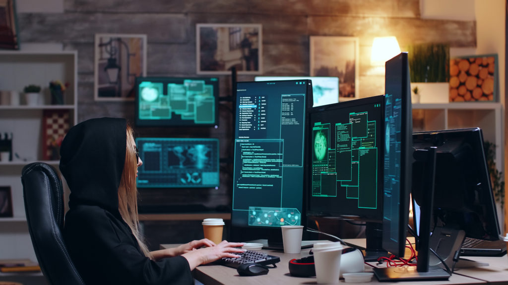 Hacker girl by her computer