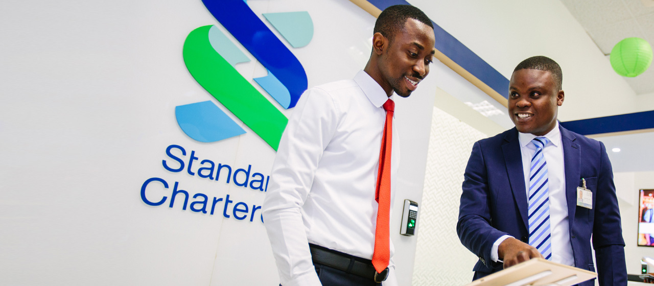 Standard Chartered branch staff using ipad