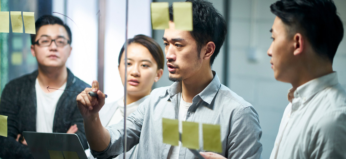 Man writing on glass