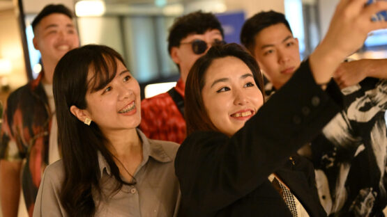 A group of standard chartered colleagues taking a selfie