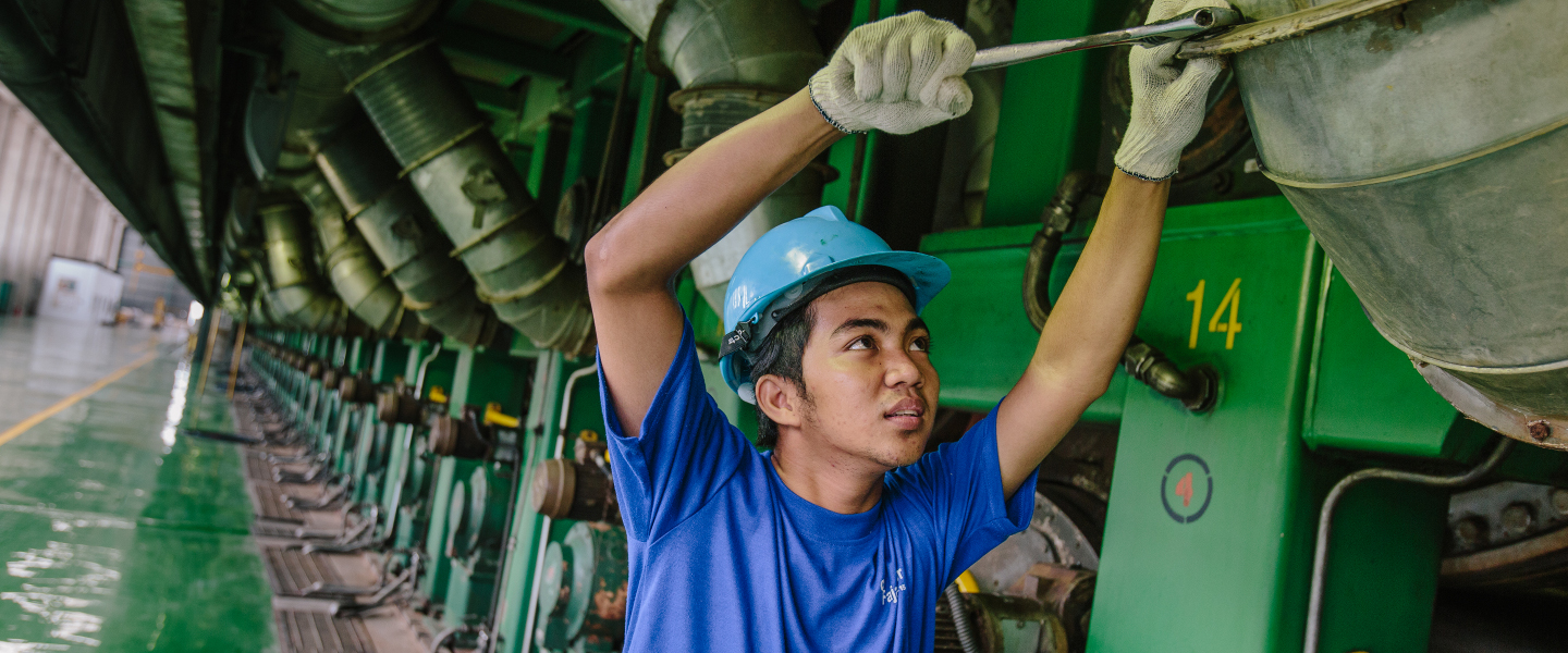 man working on large machine