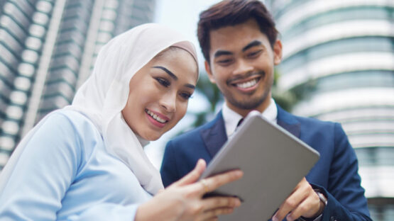 Man and woman looking at tablet