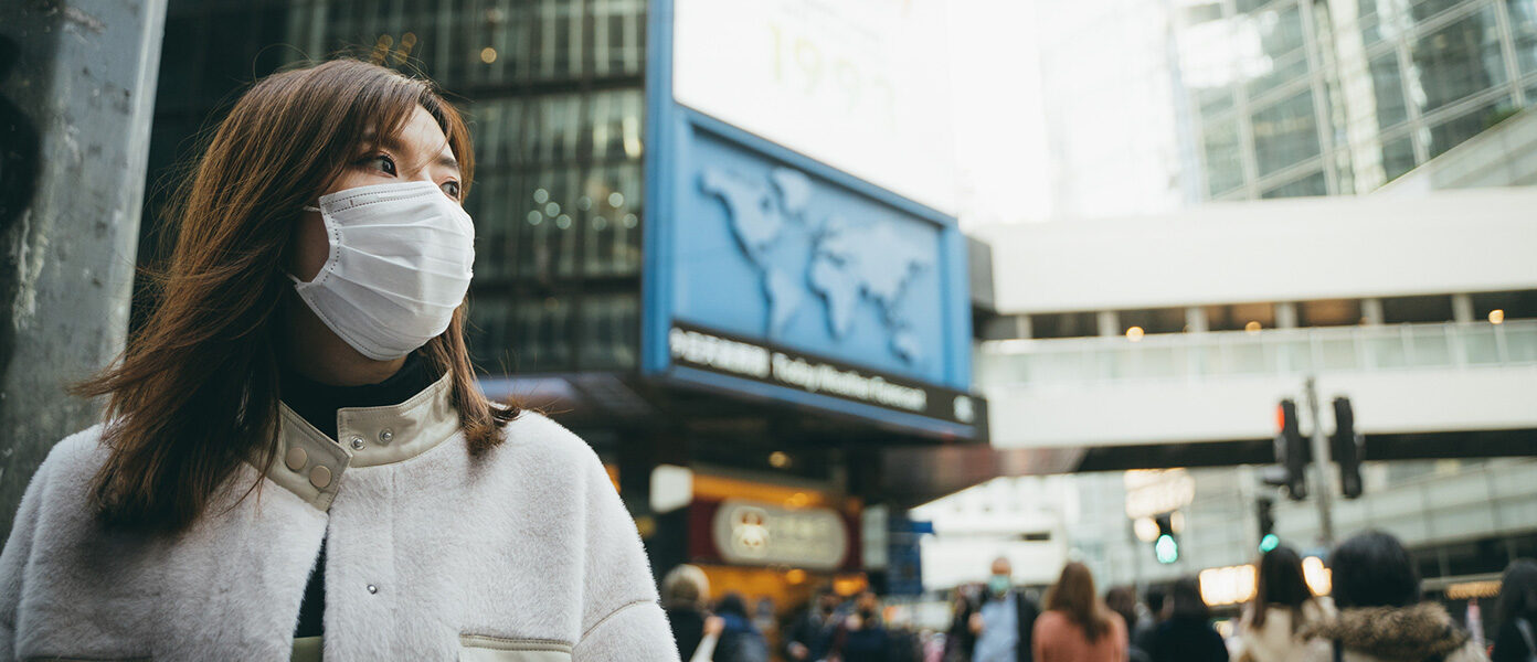 woman in city wearing face mask