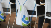 A Standard Chartered bag on a chair