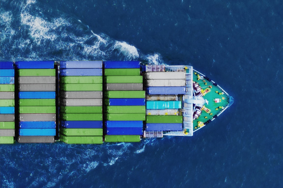 A cargo ship sails over the ocean