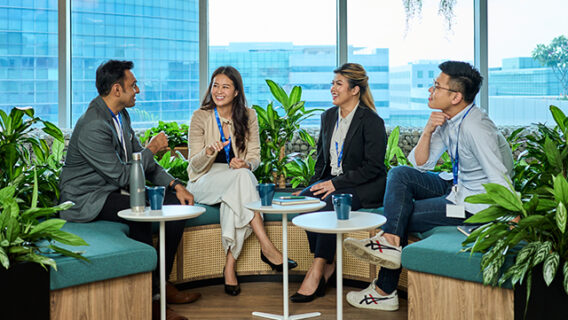 A group of Standard Chartered employees discuss wellbeing.