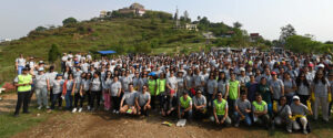 A group of Standard Chartered employees pose together on an outdoor volunteering opportunity.