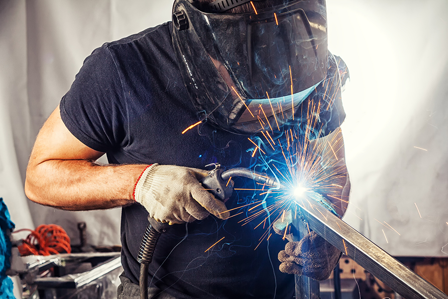 A man welds steel.