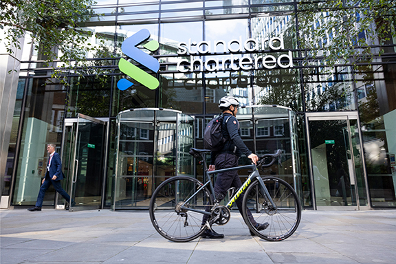 employee with the bike in front of SC office building