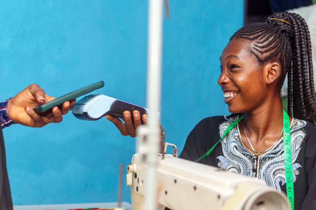 a tailor takes a contactless payment 