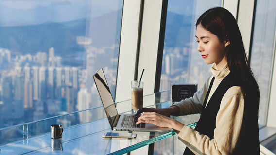 A woman works on a laptop