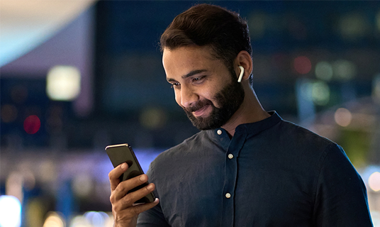 A man looks at his phone.