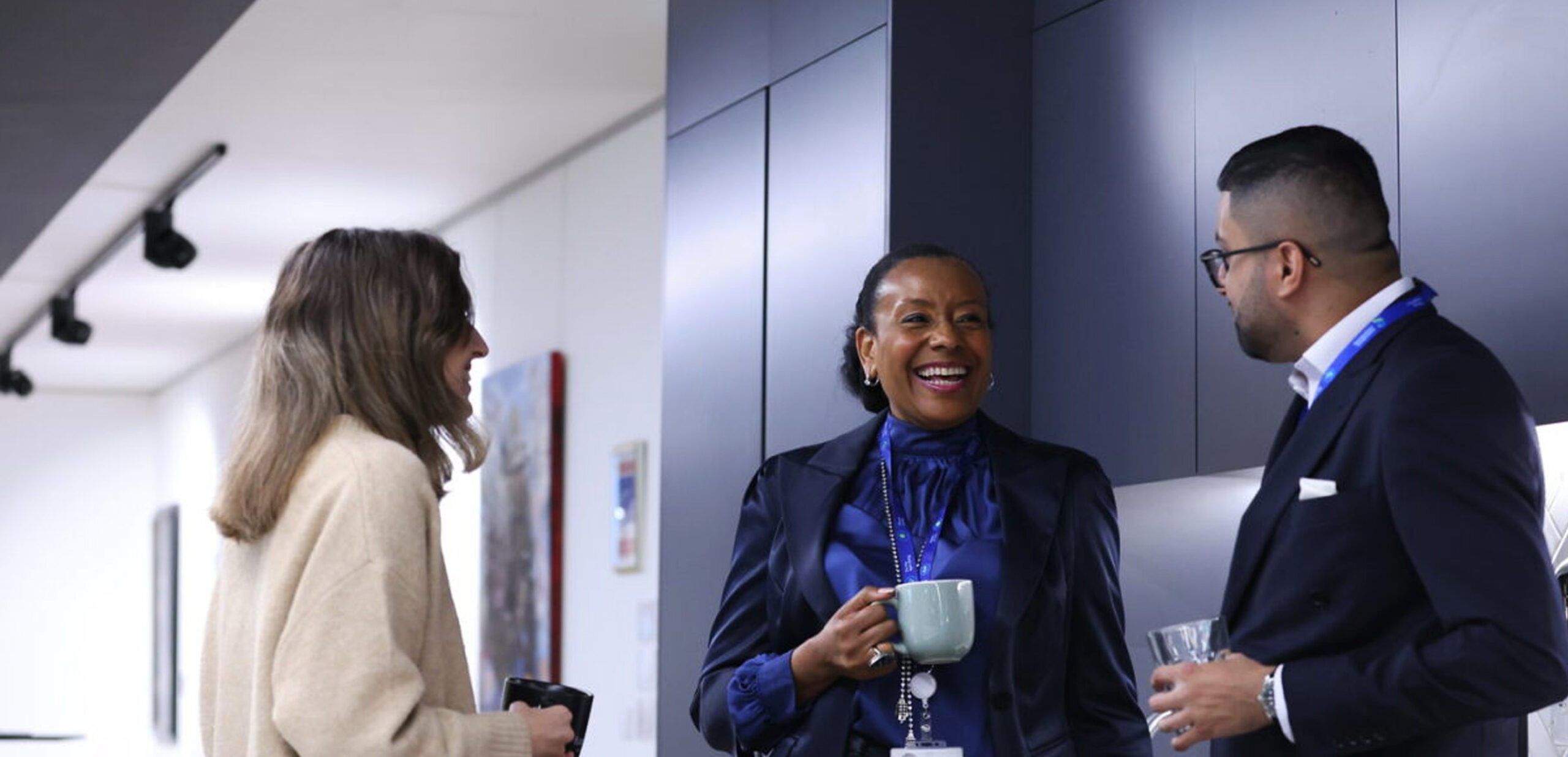 Colleagues chat in Standard Chartered's London HQ.