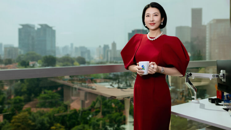 Employee with a cup in a red dress