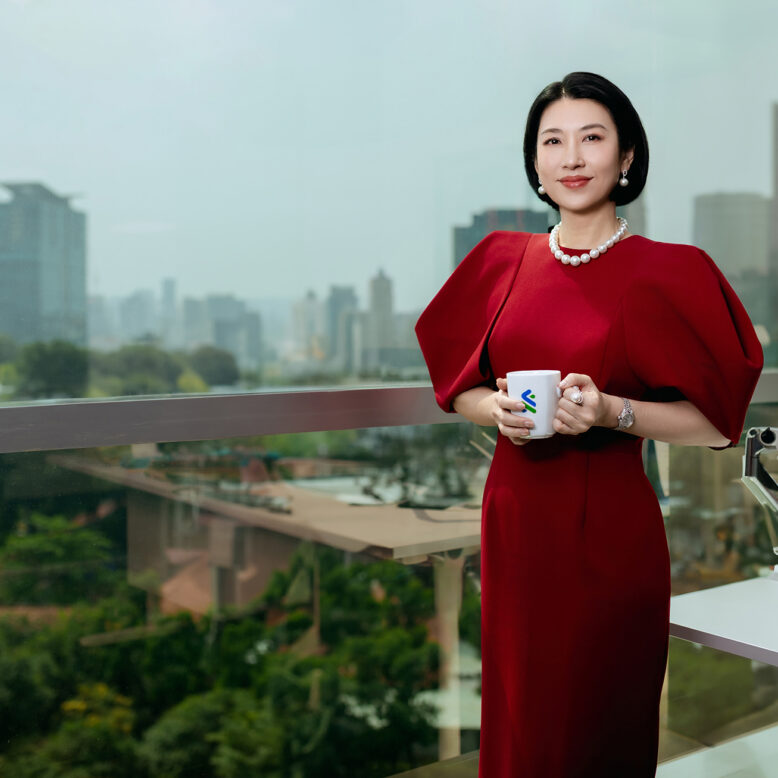 Employee with a cup in a red dress