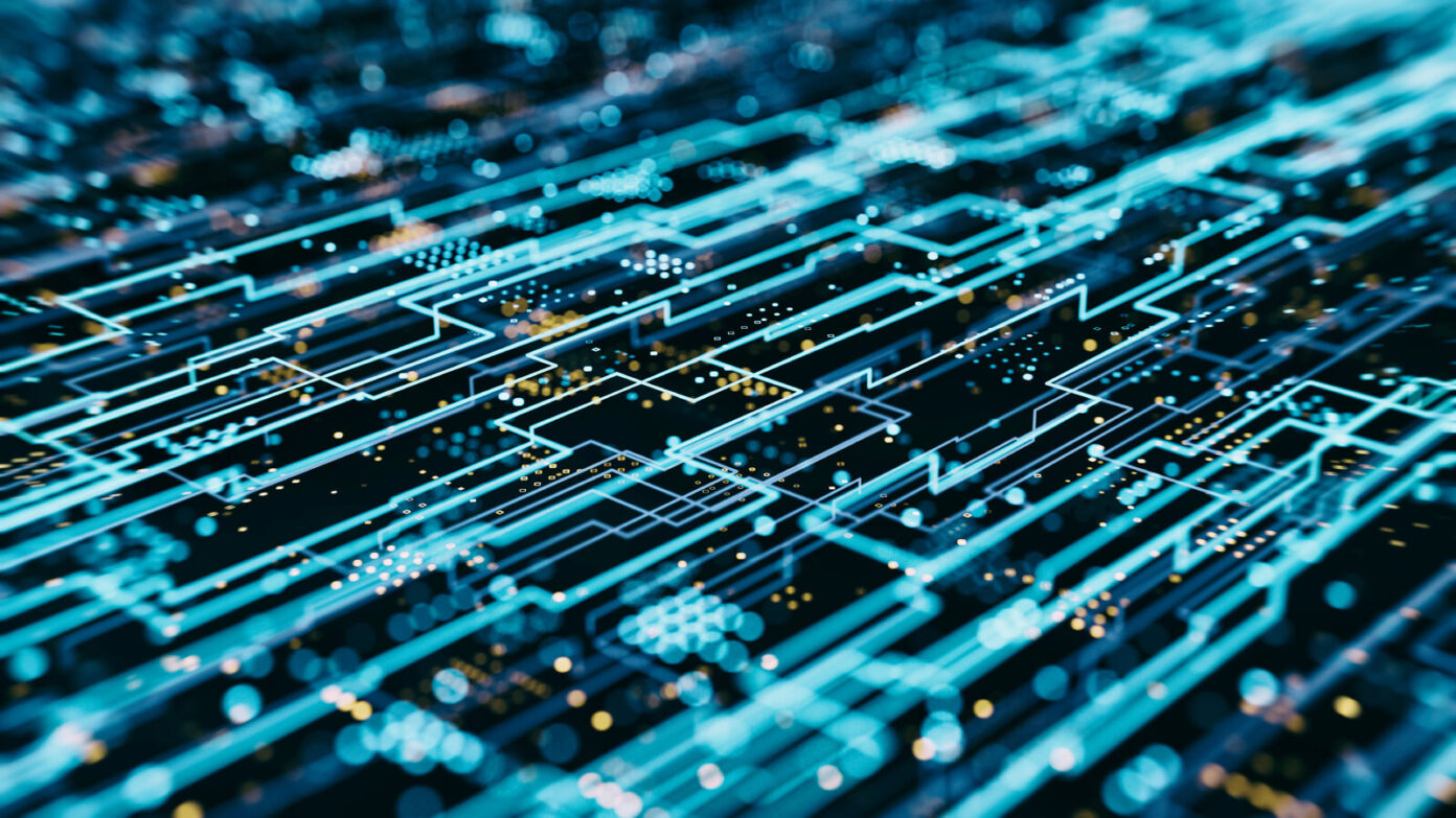 Close up of a digital circuit board with glowing blue lines and nodes, representing a complex network or electronic data flow. 