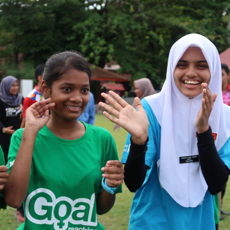 Three girls clapping